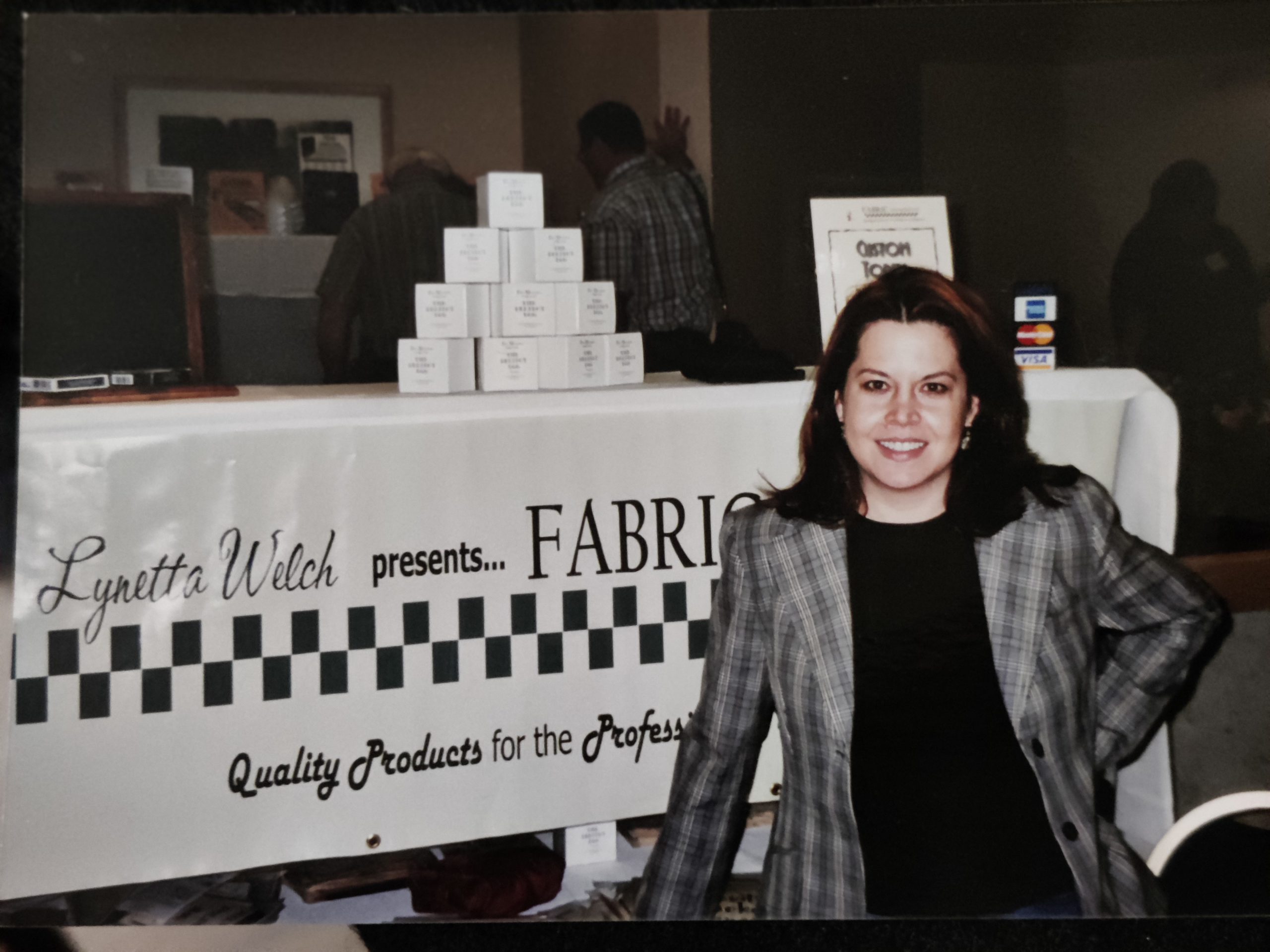 Lynetta Welch at the Fabric Manipulation booth at a magic convention.